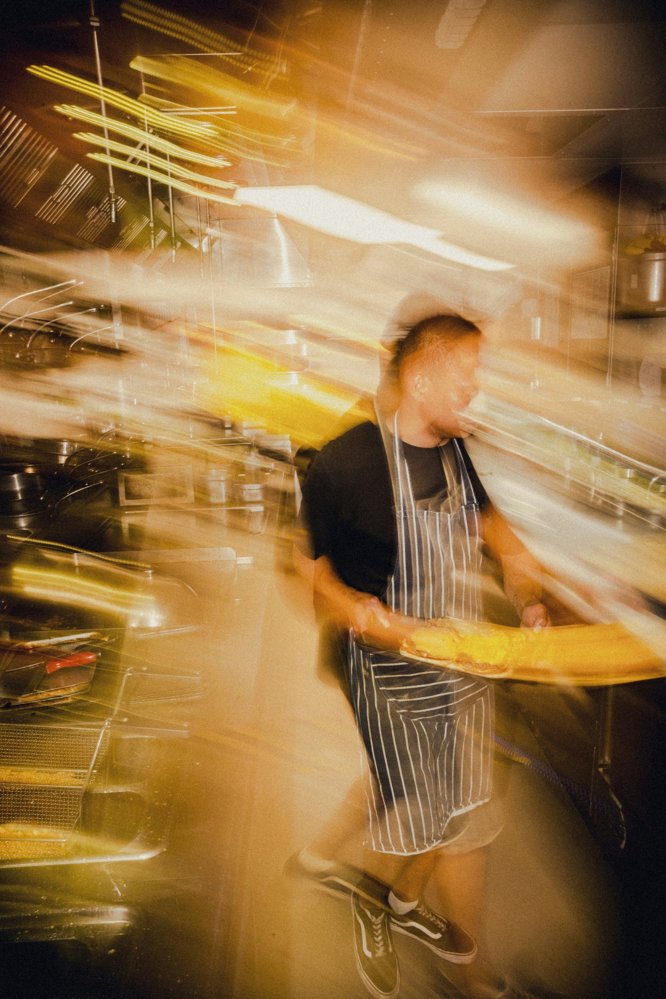 Person in a kitchen with motion blur effect