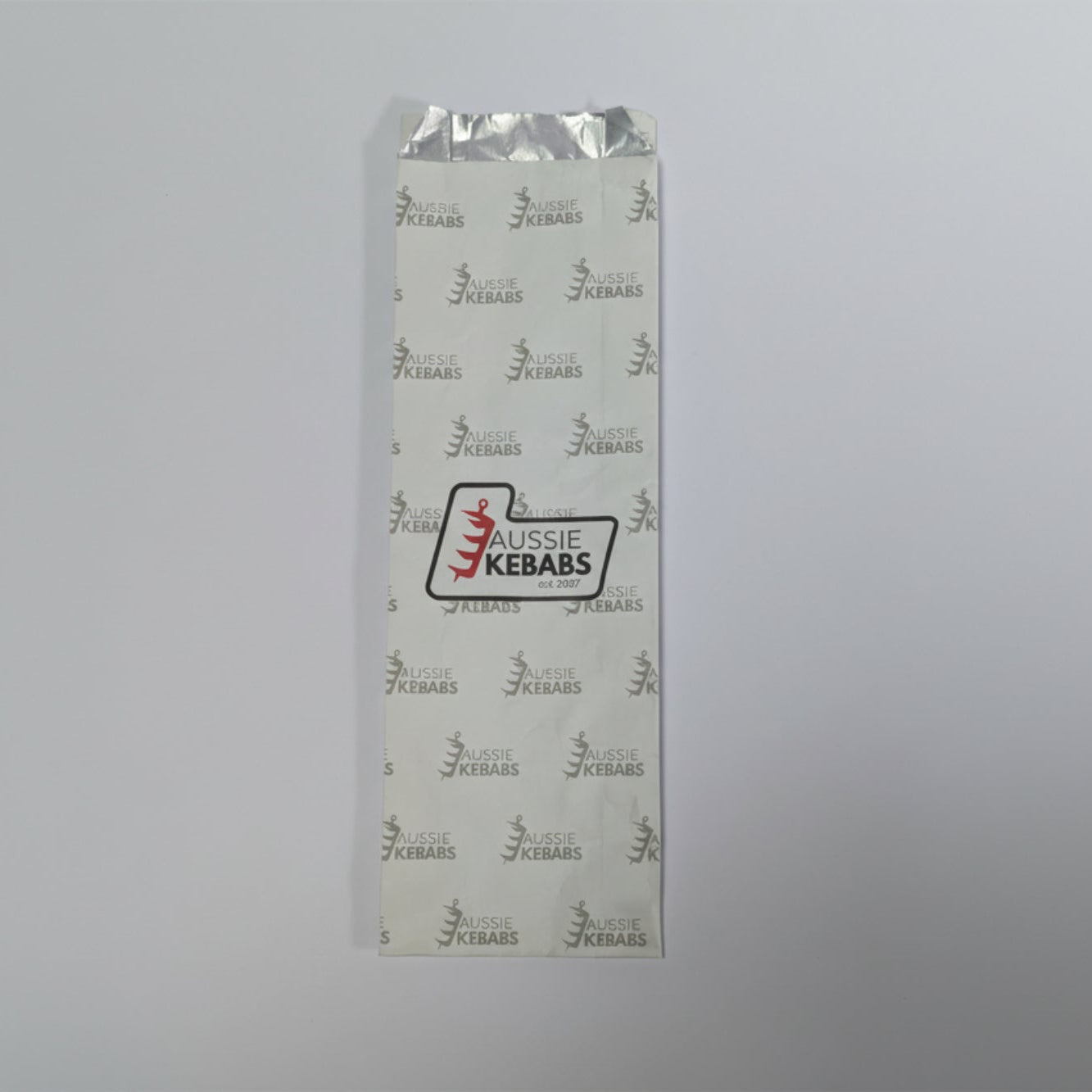 Aussie Kebabs branded packaging on a gray background