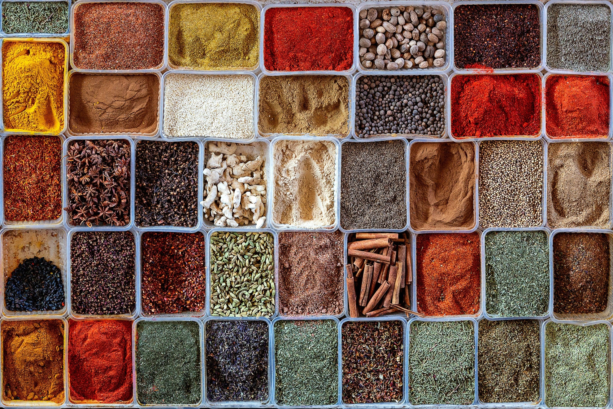 Grid of various spices in small containers