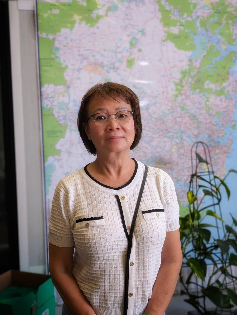 Woman standing in front of a NSW map