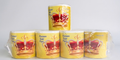 Five rolls of toilet paper with a yellow and red design on a white background